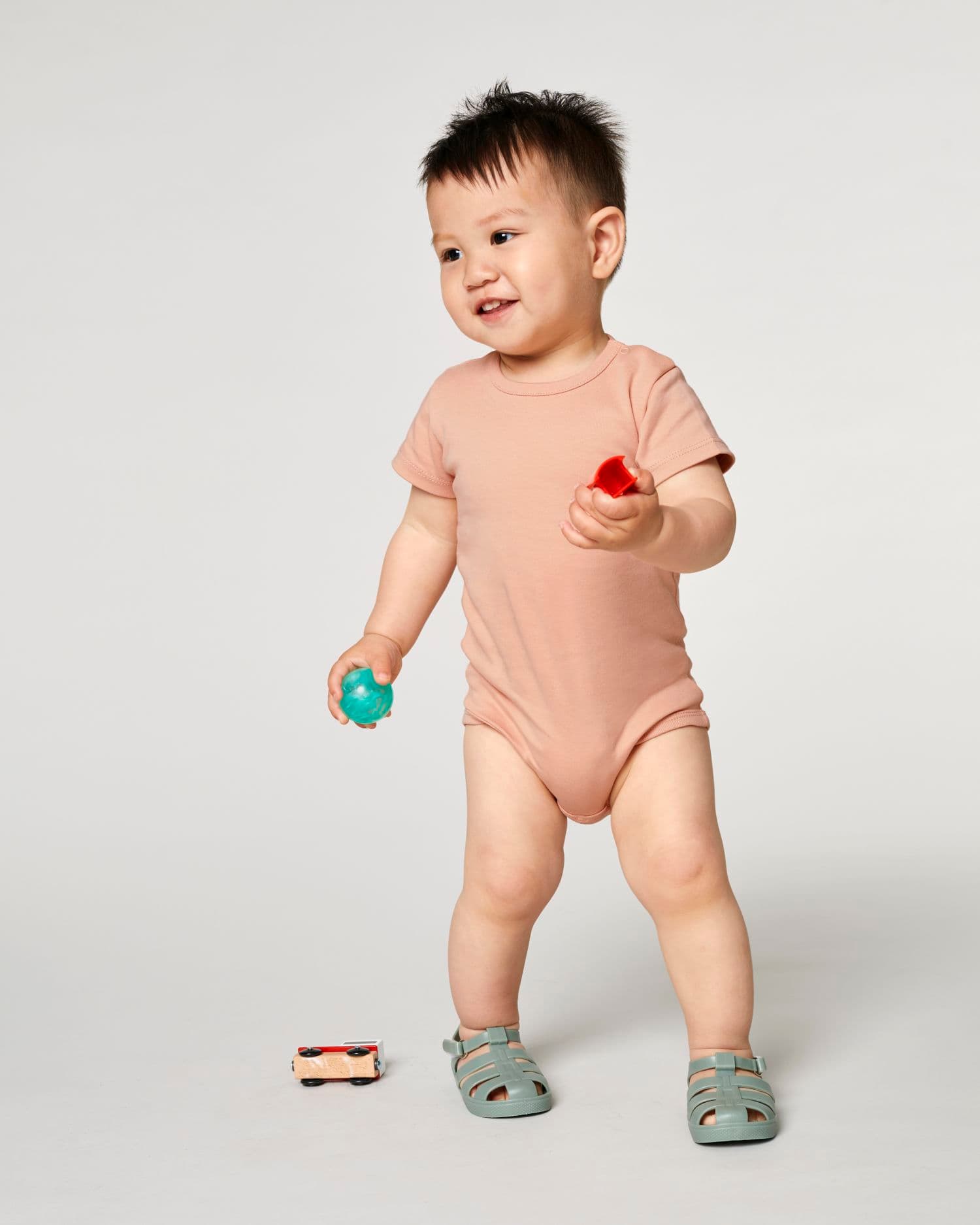 Baby Body Stanley/Stella gedragen, kleur Fraiche Peche